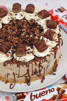 there is a cake with chocolate and cream toppings on it