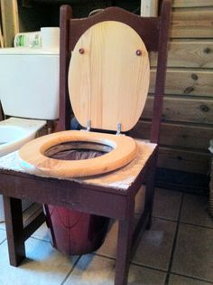 a wooden toilet seat sitting on top of a chair