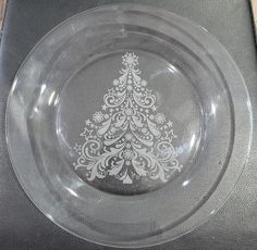 a clear glass plate with a white christmas tree on it