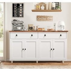 a coffee bar with white cabinets and wooden counter tops in front of an open window