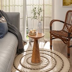 a living room scene with focus on the coffee table and chair in the center area