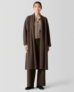 A new seasonal standard for effortless everyday style, with a minimalist silhouette that's soft and unstructured in lightweight boiled wool with winter-ready warmth. By EILEEN FISHER. Long sleeves with drop shoulders. Open front; includes pin for closure. Slash hand pockets. Long side slits. Raw-edge hem. Modern Merino Wool Outerwear For Fall, Classic Oversized Merino Wool Outerwear, Oversized Cashmere Sweater Coat For Work, Fall Merino Wool Outerwear For Work, Merino Wool Outerwear For Fall Workwear, Oversized Merino Wool Outerwear For Work, Casual Wool Outerwear For Daywear, Oversized Cashmere Outerwear For Work, Merino Wool Sweater Coat For Work