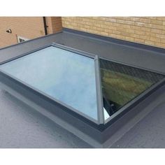 an open skylight on the roof of a building