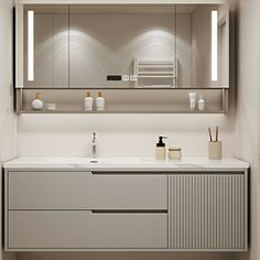 a bathroom vanity with two sinks and mirrors