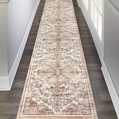 a long rug on the floor in a hallway