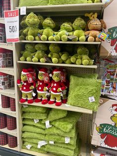 stuffed animals are on shelves in a store