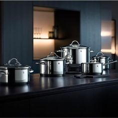 several pots and pans are sitting on a counter