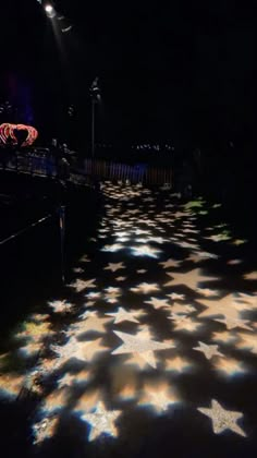 the lights are shining on the floor in the dark