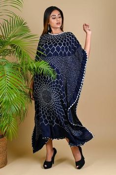 Indigo blue kaftan style dress with Bandhani motifs and handcrafted silk potli neckline.
Component: 1
Neckine: Round
Sleeve Length: Three quarter
Fabric: Gajji Silk
Color: Blue
Flared sleeves - Aza Fashions Bandhani Motifs, Kaftan Style Dresses, Black Kaftan, Bandhani Dress, Tunics Online, Kaftan Style, Batik Dress, Black Tunic, Khalid