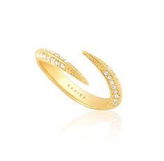 Indulge in the timeless elegance of the Brigitte Ring. This dainty ring features a delicate CZ stone that adds a touch of sparkle to any outfit. Crafted with precision and sophistication, this ring is sure to elevate your style and make you stand out in any crowd. 18k Gold Plated over Stainless Steel CZ Stones Hypoallergenic Water & Tarnish Resistant Elegant Prong Setting Midi Rings, Elegant Diamond White Stackable Crystal Ring, Elegant Diamond Midi Rings, Elegant Adjustable Diamond White Crystal Ring, Elegant Adjustable Crystal Ring In Diamond White, Elegant Adjustable Diamond Midi Rings, Elegant Adjustable Bypass Ring, Elegant Adjustable Open Bypass Ring, Dainty Adjustable Diamond Ring For Formal Occasions