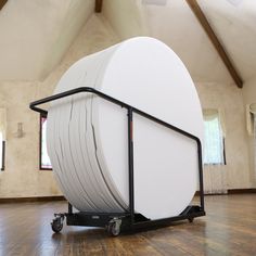 a large white object sitting on top of a wooden floor