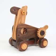 a wooden toy truck with gears on it