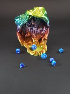 an odd looking object with blue and yellow dice