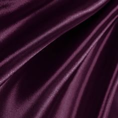 a close up view of a purple satin fabric with very thin lines on the edges