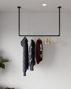 the coat rack is hanging on the wall