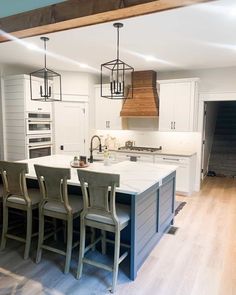 Appliances that blend with the cabinets are the newest trend in creating seamless kitchen designs. Match these appliances to the color of your cabinets for a satisfying look. Double wall ovens sit subtly between a pantry and shiplap cabinet end panels to elevate the farmhouse design of the room...   Image: rowefamily_farmhouse