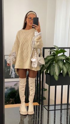 Look amazing on your date night with these beauty and fashion hacks. Neutral Cream Outfits, Casual Knit Dress Outfit, Beige Leather Boots Outfit, Knitted Sweaters Dress Outfit, Beige Boots Dress Outfit, Fall Sweater Dress With Boots, Knit Dress And Boots Outfit, Sweater Dress With Corset, Baggy Sweater Dress Outfit