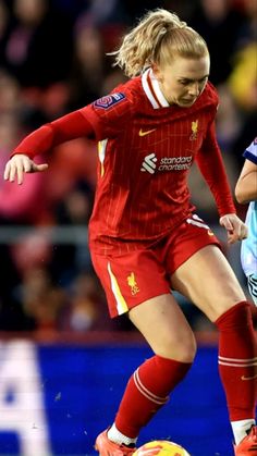 a female soccer player in action on the field