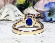 Don't miss this opportunity to own this beautiful gemstone ring crafted in 14k gold filled => Gemstone Type - Corundum Sapphire, Clear Quartz => Gemstone Cut - Faceted => Gemstone Size - 8*10 mm, 3 mm => Total Number of Gemstones - 3 => Metal Type - 14k Gold Filled (Tarnish Resistant And Nickel Free) - also available in 925 sterling silver * Please contact me for pricing on a sizes larger than 11 * ~ Feel free to ask me about custom made designs. ❏ Replacements and custom orders : Gold Oval Crystal Birthstone Ring, Gold Sapphire Ring With Oval Shape, Gold Oval Sapphire Cluster Ring, Gold Sapphire Oval Cluster Ring, Gold Oval Crystal Ring With Center Stone, Oval Birthstone Ring With Vs Clarity In 14k Gold, Oval Sapphire Cluster Ring In Gold, Gold Opal Ring With Prong Setting And Oval Shape, Oval Gold Opal Ring With Prong Setting