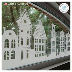 an image of a window with buildings drawn on it