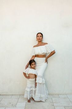 Mommy’s little fashionista is ready for the runway in our new White Emily Ruffled Skirt Set. This stunning two piece kid’s set is designed with lightweight cotton fabric for a breathable and fresh feeling. Featuring a dreamy off the shoulder crop top with an elastic strapless neckline, a ruffled design, and interior lining for comfort. The maxi skirt comes with a flattering smocked upper waist with charming ruffle tiers. Have a mommy and me moment with our matching SIENNA RUFFLED SKIRT SET for a Bebe Shower, Mommy And Me Photo Shoot, Mom Daughter Outfits, Mommy Daughter, Ruffled Skirt, Stunning Outfits, Mother And Daughter, Copy Paste, Girl Mom