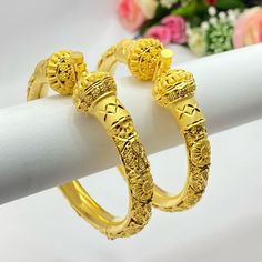 22k Gold Plated Openable Bangles/Kangan/kare/Bridal Indian Jewelry Wedding Jewellery It is a perfect match with formal attire on special occasions or with casual wearing Care instructions Keep Jewellery away from direct heat, water, perfumes, deodorants and other strong chemicals as they may react with the metal or plating. The plating composition of Jewellery is as such that  perspiration (sweat) will not damage it. Wipe Jewellery gently with chamois cloth or leather swatch after every use. Wiping the jewellery with a soft cloth after removing the jewellery would add to its life. Avoid water  exposure for all jewelry  Thank You For Visiting Gold Bollywood Bracelets For Formal Occasions, Formal Gold Bollywood Style Bracelets, 22k Gold Wedding Bangle, Formal Bollywood Gold Bracelets, Gold Bridal Sets With Meenakari For Formal Occasions, Bollywood Style Formal Gold Bracelets, Formal Gold Bridal Sets With Meenakari, Gold Meenakari Bridal Sets For Formal Occasion, Gold Cutdana Wedding Dress