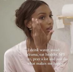 a woman is looking at her face in the mirror with a caption that reads i drink water, avoid drama, eat healthy, spf so pray and just do what makes me happy