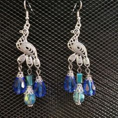 Antique Silver And Blue Peacock Earrings. Faceted Royal Blue And Iridescent Aqua Glass Crystal Teardrop Tail. Weight: 0.2 Oz/7 Grams Each (Heavy). 3.5 Inches/8.9cm From The Top Of The Ear Wire. Ear Wires Are Stainless Steel. Brand New, Never Worn Nwt. Handmade By Me, The Sparkliefiend! Blue Nickel-free Teardrop Earrings For Party, Nickel-free Blue Teardrop Earrings For Party, Elegant Blue Peacock Design Earrings, Blue Bohemian Jewelry With Peacock Design, Bohemian Blue Jewelry With Peacock Design, Elegant Blue Peacock Design Jewelry, Trendy Jewelry Ideas, Peacock Earrings, Blue Peacock