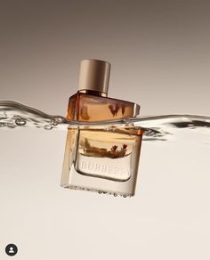 a bottle of burber cologne floating in the water