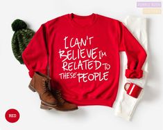 a red sweater that says have yourself merry little christmas