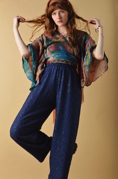 Due to this garment being handmade, please allow up to 7-14 days for this item to be shipped. Effortlessly magic, The Bowie Trousers beckons you to get lost in a bohemian reverie. Ornate and ethereal complete with sequin embroidery, elasticated waist and a cropped length tapered leg fit. Their lightweight feel makes them easy to pair back for summer or dress up with boots and a jacket for a night out under the disco ball. SIZE GUIDE: UK 6 - (WAIST 24", HIPS 40") UK 8 - (WAIST 26", HIPS 40") UK 1 Hippie Style Fall Festival Pants, Hippie Fall Festival Pants, Blue Bohemian Embroidered Pants, Bohemian Blue Embroidered Pants, Blue Bottoms For Fall Festival, Bohemian Blue Pants For Fall, Womens Trousers, Sequin Embroidery, Sequins Embroidery