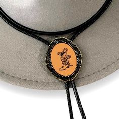 Our handmade bolo tie has a snake in a cowboy boot with a glass coating. PERFECT for a country western cowboy tie, western string tie, cowboy necktie, or any special person in your life! The metal backing makes it easy to adjust and the cord stays put. *Makes a Great Gift* Pendant Size: 1.5 in x 1.25 in Cord in Black Genuine Leather: 39in Cowboy Necktie, Cowboy Tie, Glass Coating, Bolo Tie, A Snake, Cowboy Boot, Country Western, Special Person, Western Cowboy