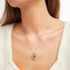 This pretty necklace for her features a double heart-shaped pendant traced in shimmering diamond accents. At the center sits a beautiful heart-cut blue lab-created sapphire to complete the romantic design. The sterling silver pendant is suspended from an 18-inch box chain and secures with a lobster clasp. Sapphire Heart Pendant Birthstone Jewelry, Sapphire Heart Pendant With Heart Charm, Sapphire Heart Pendant Jewelry For Valentine's Day, Anniversary Sapphire Jewelry With Heart Charm, Sapphire Heart Pendant Necklaces For Valentine's Day, Sapphire Heart Pendant For Anniversary, Sapphire Heart Pendant Necklace For Valentine's Day, Sapphire Heart Cut Birthstone Jewelry, Heart Cut Sapphire Birthstone Jewelry