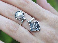 Sterling Silver Ethnic Boho Thumb Adjustable Pearl Spoon Ring, Sun Grunge Ornament White Stone Open Ring, Armenian Jewelry Boho style is a symbiosis of glitz and poverty due to the fact that sometimes incongruous things are combined in clothes. Elements of different cultures harmoniously coexist in it, so this is not just a fashionable direction, it is a whole aesthetic worldview. The girls who prefer this style are usually pacifists who share the idea of world citizenship. Ring width 35*15 mm. Bohemian Flower Ring For Wedding, Bohemian Adjustable Flower Ring For Anniversary, Bohemian Handmade Toe Rings For Wedding, Adjustable Bohemian Toe Rings For Wedding, Adjustable Bohemian Wedding Toe Ring, Armenian Jewelry, Spoon Ring, Spoon Rings, White Band