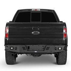 the back end of a black truck on a white background with no people in it