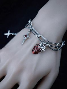 Elevate your gothic style with our handmade heart and cross charm silver bracelet. This exquisitely crafted piece features a striking combination of heart and cross charms, adding a touch of mystery and allure to your ensemble. The bracelet is meticulously handmade to ensure high quality and attention to detail.   Please note that this product includes only the bracelet. Bracelet Gothic, Gothic Accessories Bracelets, Handmade Gothic Silver Bracelets, Adjustable Gothic Metal Bracelets, Adjustable Gothic Bracelet, Gothic Heart-shaped Jewelry With Adjustable Chain, Halloween Wings, Anatomical Jewelry, Red Gothic