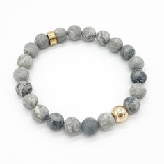 PRICES MAY VARY. Map Stone Bead Bracelet: Features an 18K Gold-Plated charm and 8mm Map Stone beads. Long-term wear of this bracelet helps promote a sense of well-being and enhances personal confidence. Gemstone Beaded Bracelet: Crafted with high-quality 8mm Map Stone beads and a strong elastic cord. The smooth finish of the beads makes them comfortable and durable for daily wear. Stretch Bead Bracelet: Hand-strung with natural Map Stone beads, this bracelet is designed to be comfortable and sui Map Stone, Jasper Bead Bracelet, Amulet Bracelet, Lava Rock Bracelet, Style Birthday, Essential Oil Diffuser Bracelet, Sterling Silver Bead Bracelet, Crystal Healing Bracelets, Silver Bead Bracelet