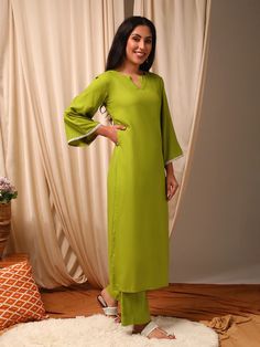 This green Kurta with Trousers set is made from a luxurious silk blend fabric, creating a stylish and comfortable outfit. The Kurta features a straight shape and round neck with flared three-quarter sleeves, while the Trousers have a partially elasticated waistband and slip-on closure for ease of wear. With a calf leng Light Green Kurti Combination, Green Kurti Combination, Light Green Kurti, Kurti Combination, Combination With Black, Green Kurti, Western Kurtis, Comfortable Outfit, Kurtis With Pants