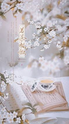 an image of a tea cup and saucer on a table with flowers in the background