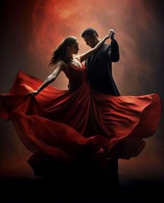 a man and woman in red dress dancing