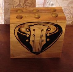 a wooden box with an image of a cow's head on the front and sides