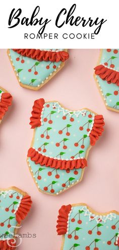 baby cherry romper cookies on a pink background