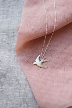 This sterling silver swallow necklace is a beautiful & feminine must have piece!Oh so pretty!— d e t a i l s —-swallow pendant measures 2.5 x 2.5cm-hand sawn from sterling silver-completed in a mirror finish-includes a 45cm silver chain-All Lola&Cash jewellery will arrive in gift giving mode>>>——————————<<<>>>——————————<< Elegant Sterling Silver Necklace With Bird Design, Sterling Silver Bird Necklace, Silver Bird-shaped Sterling Silver Necklace, Elegant Silver Necklace With Bird Shape, Swallow Jewelry, Swallow Necklace, Tarnished Silver, Bird Necklace, Bird Jewelry