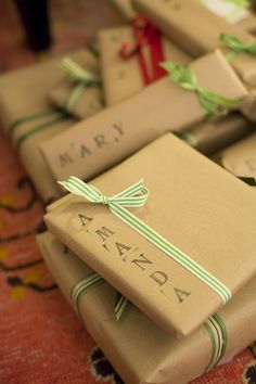 many wrapped presents are stacked on top of each other with the word marry written on them