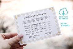 a person holding up a certificate in their hand