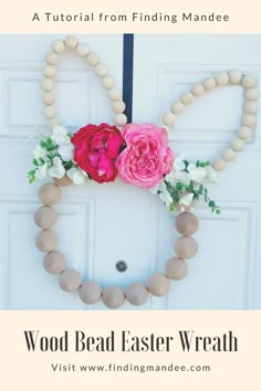 a diy wood bead easter wreath with flowers on it