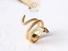 ABOUT PRODUCT This 14K Gold Snake Ring is suitable gift for girlfriend, mom and her. You can even buy as a birthday gift for your friends or anniversary gifts, If you want to add a special note we can write for you and put to inside of package. We manufacture our jewelry pieces with carefully and after production we double checking in quality control department. Our main idea is keep our items for daily wearing especially for minimalist jewelry pieces. 14K Gold Snake Ring, Wrap Snake Band, Daint Elegant Snake Shape Ring As Gift, Elegant Snake Shape Ring For Gift, Elegant Snake Shape Ring Gift, Handmade Snake Open Ring As A Gift, Handmade Open Snake Ring As Gift, Handmade Open Snake Ring For Gift, Elegant Adjustable Snake Ring As Gift, Handmade Open Snake Ring Gift, Yellow Gold Snake Ring As Gift