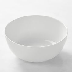 a white bowl sitting on top of a table