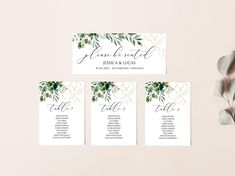 wedding seating cards with greenery on them