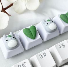 the key board is decorated with animals and leaves on it's keyshells